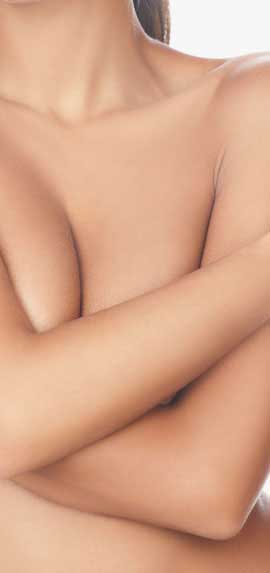 woman wrapping arms around chest