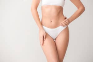 A cropped shot of a woman's torso after VASER Liposuction With a Hi-Def Tummy Tuck