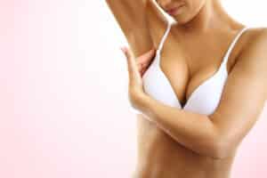 A cropped shot of a woman's cleavage after Preservé™ breast augmentation recovery
