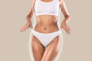 Woman showing body contours after liposuction.